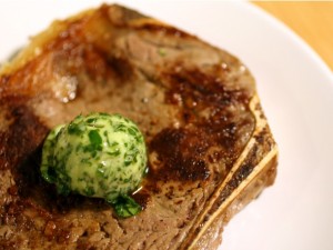 Beurre Maître d'Hôtel, stuffed with parsley, on a juicy, charred sirloin steak